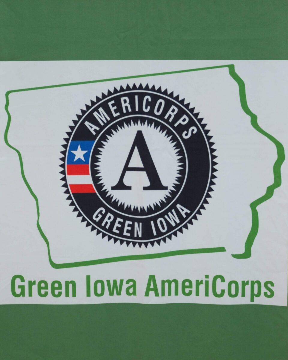 AmeriCorps Green Iowa logo displayed inside an outline of the state of Iowa, with the text 